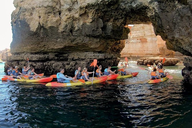 2-hour Kayak Tour of Ponta da Piedade Caves and Beaches - Returning to the catamaran for a swim
