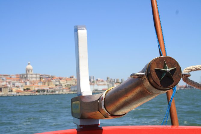 2-Hour Lisbon Traditional Boats Sunset Cruise with White Wine - From Praça do Comércio to the 25 de Abril Bridge