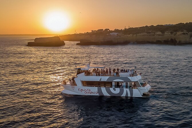 Albufeira: 6-Hour Sunset Dinner Catamaran Cruise with Open Bar - Music, fire performance, and the beach after dark
