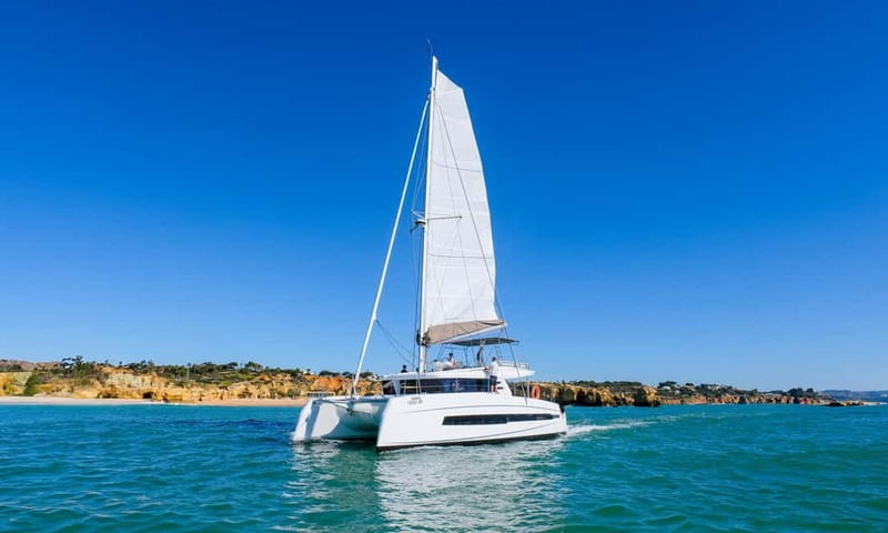 Albufeira: Algarve Sunset Sailing Experience - Swimming Stops and What to Pack