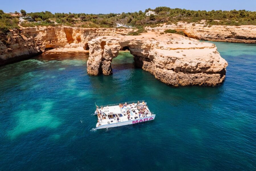 Albufeira: Caves and Coastline Catamaran Cruise to Benagil - The crew, languages, and overall atmosphere