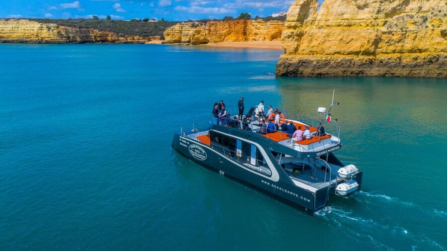 Albufeira: Coastline and Benagil Caves Tour by Catamaran - Music, bar service, and the small practical comforts
