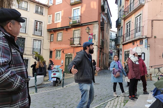 Alfama Tour in Lisbon Old Town - Small squares, local customs, and Saint Michael