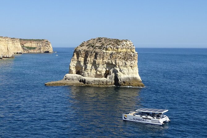 Benagil Caves & Coast from Portimão on an Eco-Friendly Catamaran - Farol de Alfanzina and the first caves