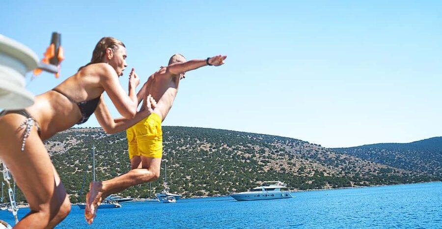 Boat Party to the Beach with Swimming Stops, DJ and Open Bar - Staff and safety on board