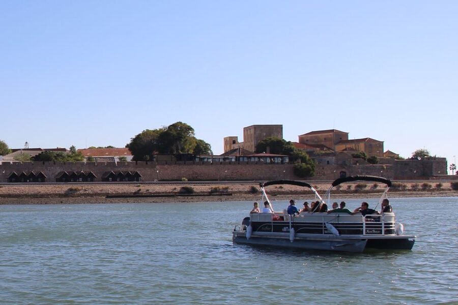 Faro: Ria Formosa Lagoon Small Boat Tour with Local Guide - Faro’s old walls from the water
