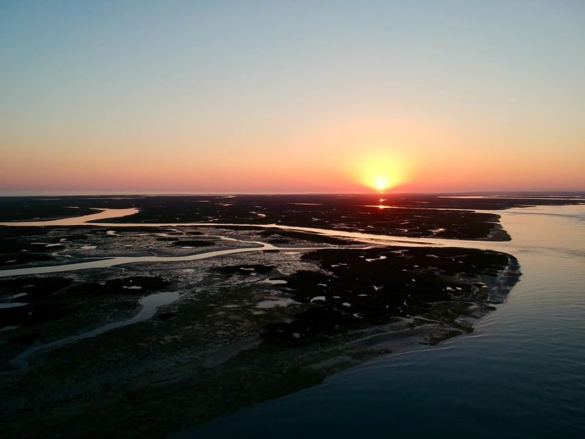 Faro: Ria Formosa Sunset Nature Boat Tour - A golden-hour view of Faro’s tidal world