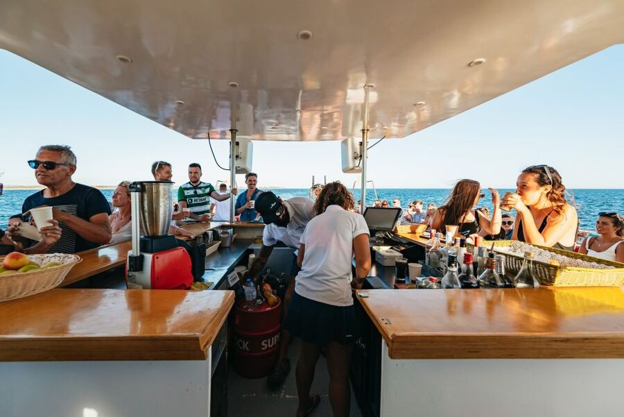 From Albufeira: Sunset Cruise and Beach BBQ with Open Bar - Music, fire performance, and the party boat home