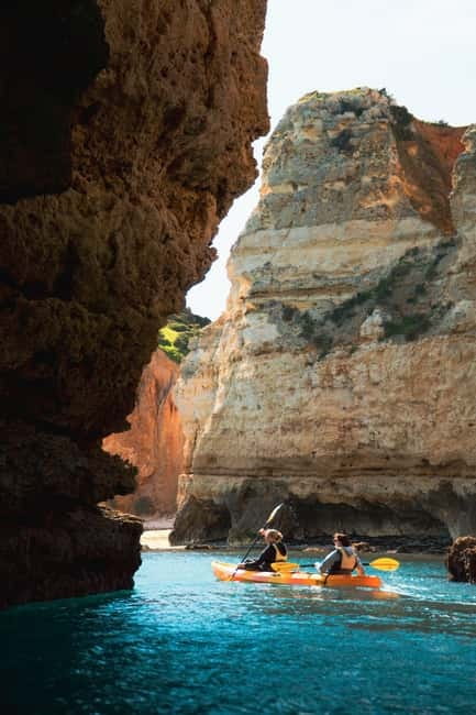 From Lagos: Ponta da Piedade Caves Kayak Tour from Catamaran - The swim stop and catamaran slide