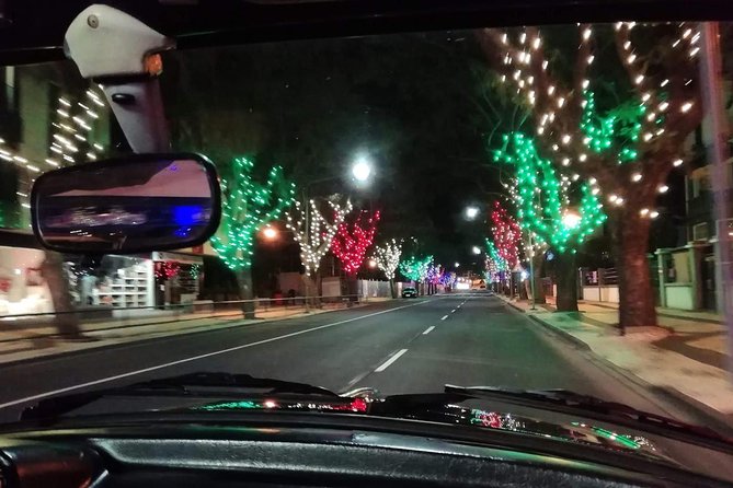 Funchal Christmas lights sightseeing night tour - Climbing into the vintage open-top car