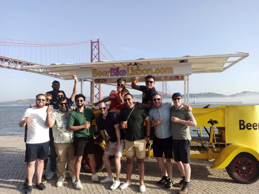 Lisbon: 1-Hour Beer or Sangria Bike Sightseeing Tour - 25 de Abril Bridge and the riverside photo stop
