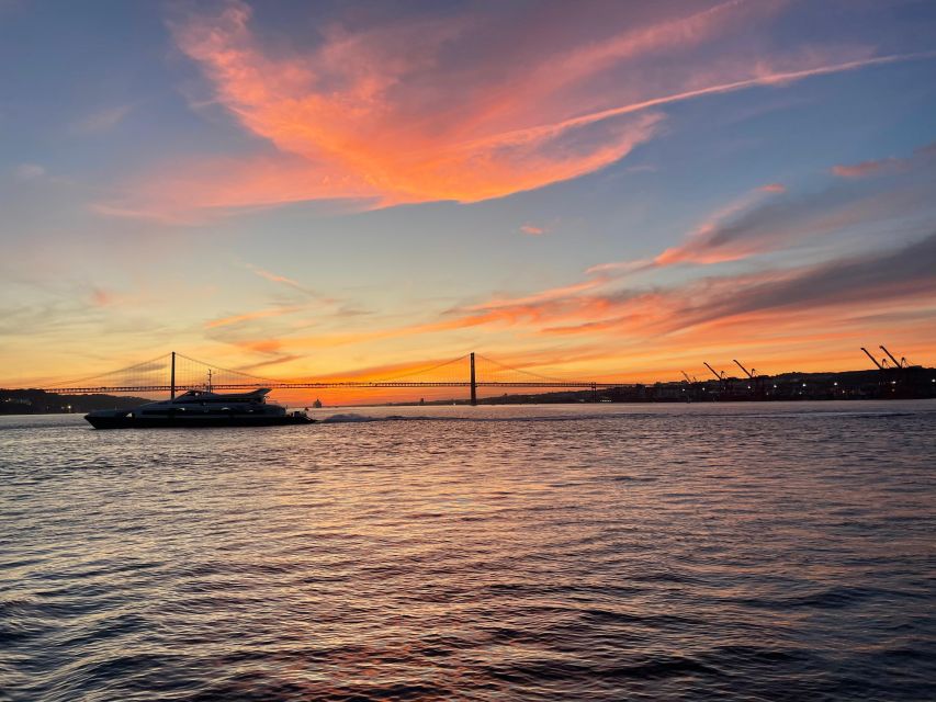 Lisbon: 2H Sunset Boat Cruise Tour with Drinks - Passing beneath the 25th of April Bridge