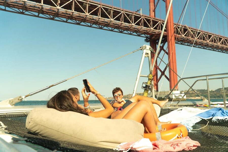 Lisbon: Catamaran Boat Party with Music, Open Bar & Dives - What this Tagus River party is really about