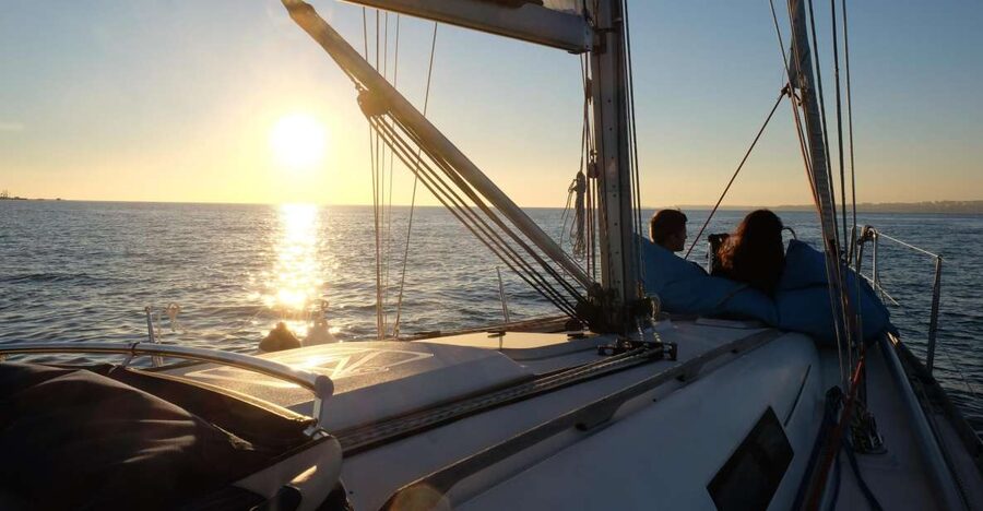 Lisbon: City Skyline Sailboat Cruise with Drink and Snacks - Sunset departures and changing weather