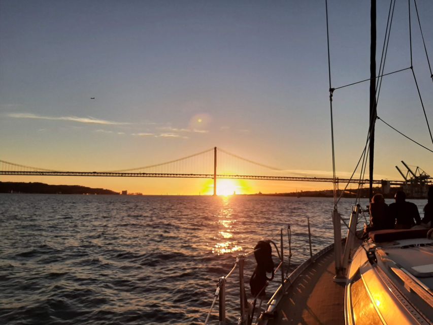 Lisbon: City Skyline Sailboat Cruise with Drink and Snacks - Santo Amaro Dock and boarding
