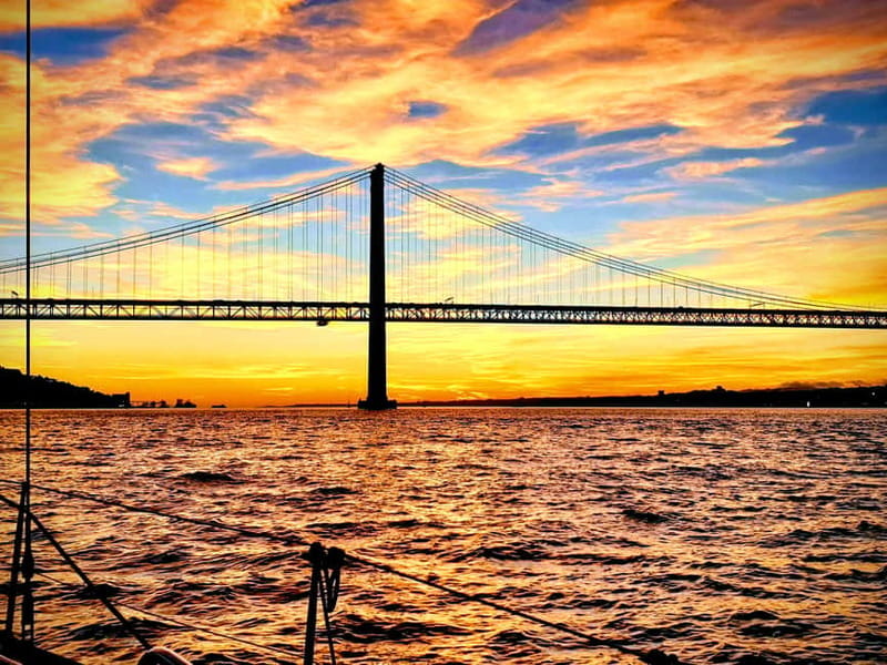 Lisbon: Daytime or Sunset Boat Cruise with History and Wine - Under the 25 de Abril Bridge