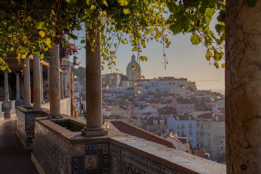 Lisbon: Early Morning TukTuk Tour - hotel/cruise ship pickup - A private cyan-blue tuk-tuk and a real local guide
