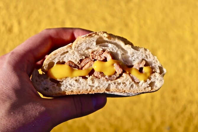 Lisbon Food Tour with 10+ Tastings of Local Delicacies & Wines - Baixa, Praça do Rossio, and the city’s grand center
