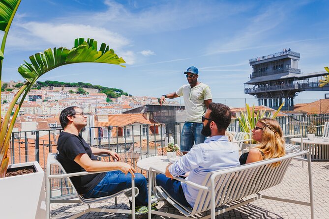 Lisbon Hidden Gems Walk: Traditions, Lunch and Ferry ride - Rossio Square, the train station, and Lisbon’s pavement