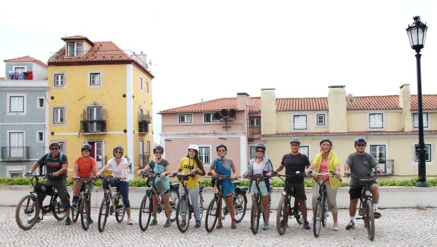 Lisbon: Hills, Alfama, and Mouraria Tour by Electric Bike - Riding through Alfama’s narrow streets