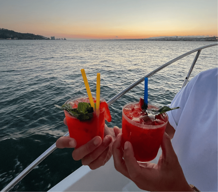 Lisbon: Private Luxury Catamaran Tour with Welcome Drink - Passing beneath the 25th of April Bridge