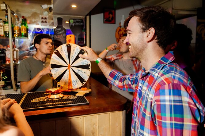 Lisbon: Pub Crawl with Open Bar, Shots & VIP Club Entry - Pink Street and the walk toward Cais do Sodré