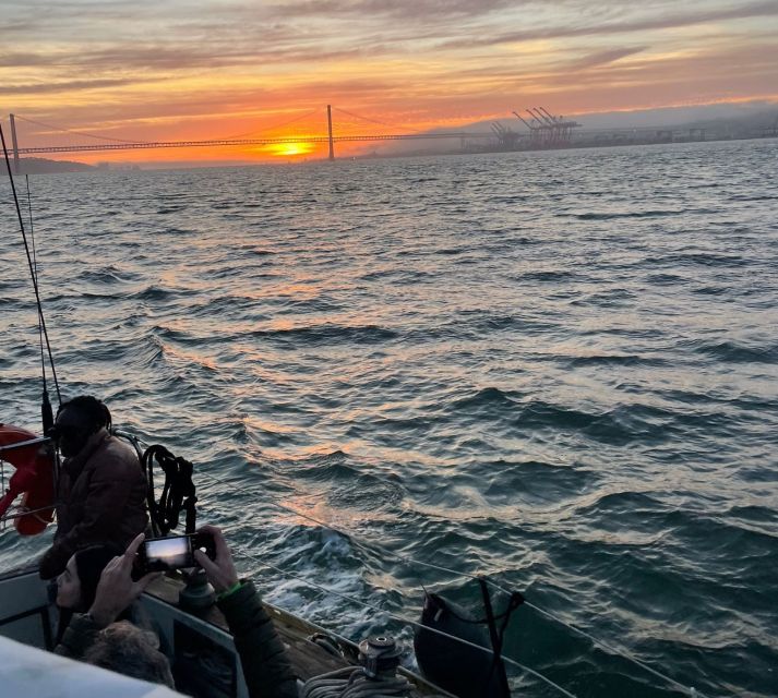 Lisbon: Sailboat Sunset Tour with a Drink - Belém Tower at golden hour