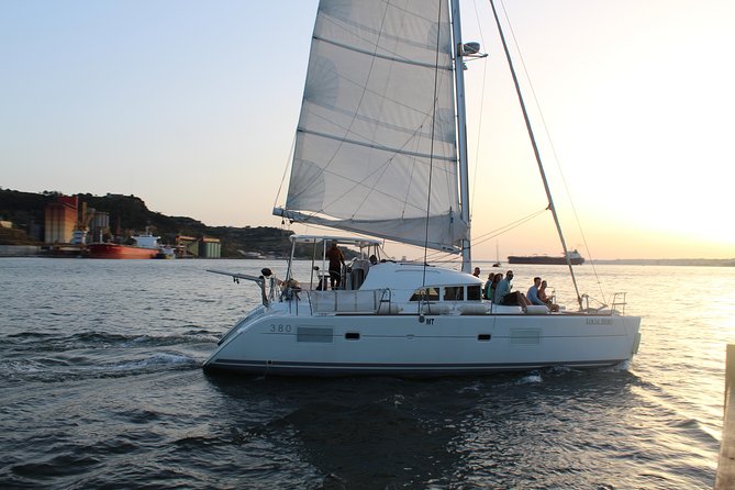 Lisbon Sailing Catamaran Public Cruise with drinks - Praça do Comércio opens the river view