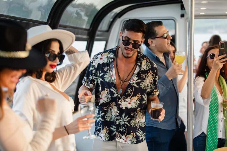 Lisbon: Sunset/Night Boat Party with Open Bar, Snacks & DJ - Crossing beneath the 25th of April Bridge