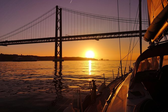 Lisbon Sunset Sailing Tour on Luxury Sailing Yacht with 2 Drinks - Wine, cheese, and the pace of the evening