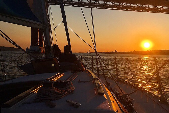 Lisbon Sunset Sailing Tour with White or Rosé Wine and Snacks - Passing beneath the 25 de Abril Bridge