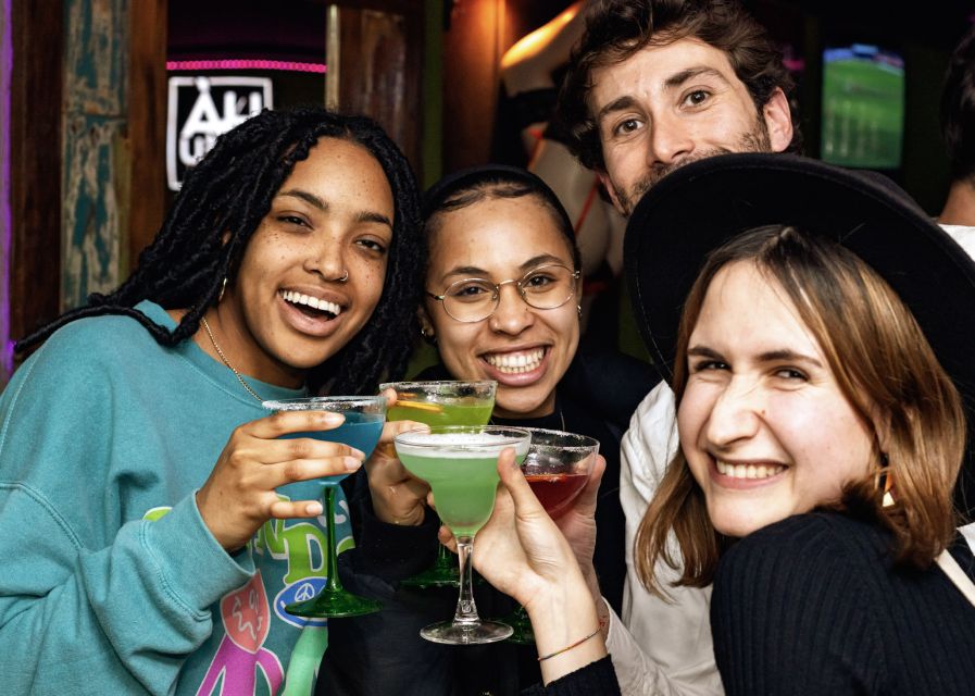 Lisbon: Tipsy Tour Fun Bar Crawl with a Local Guide - Walking through Bairro Alto after dark