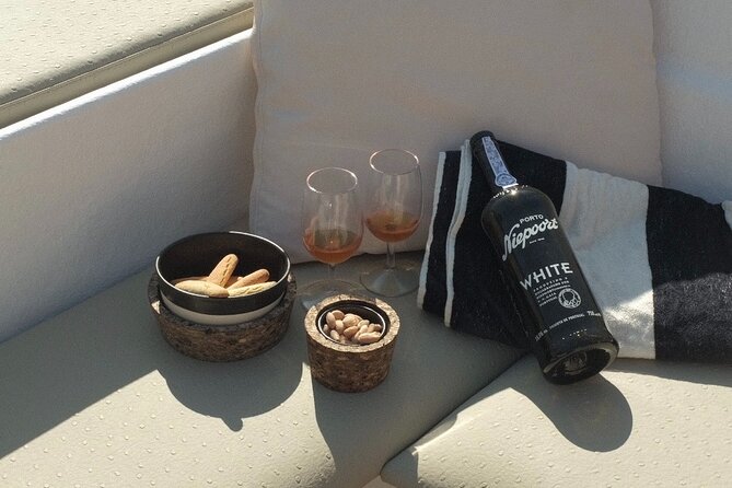 Porto: Douro River Boat Cruise with Port Wine and Snacks - A small boat instead of a floating crowd
