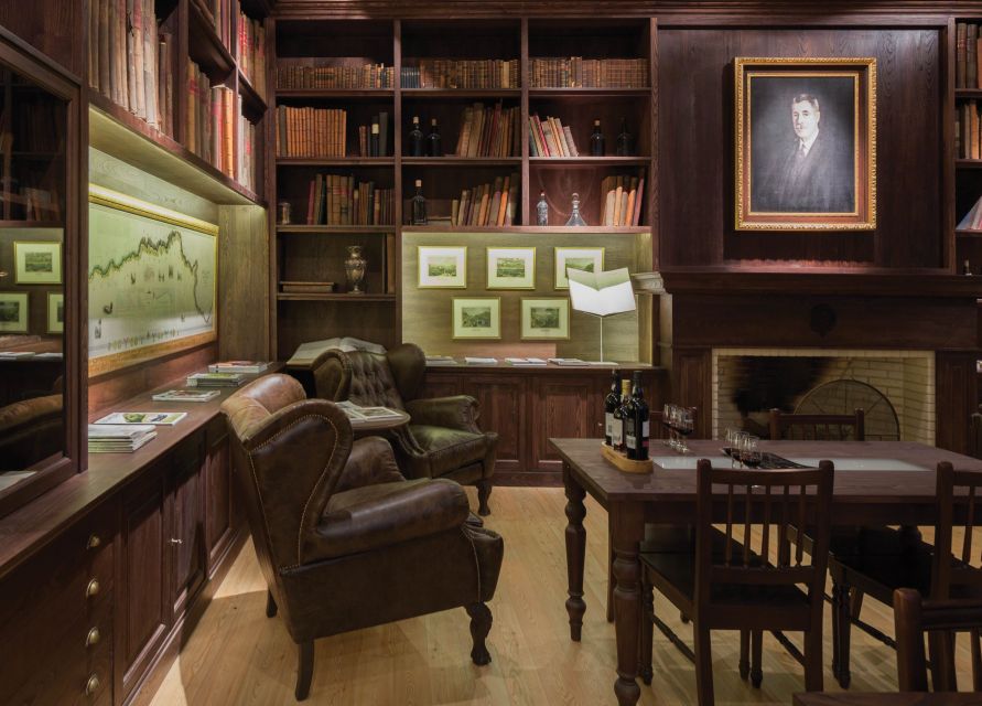 Porto: Graham's Port Lodge Tour & Vintage Room Wine Tasting - Walking through a working Port cellar