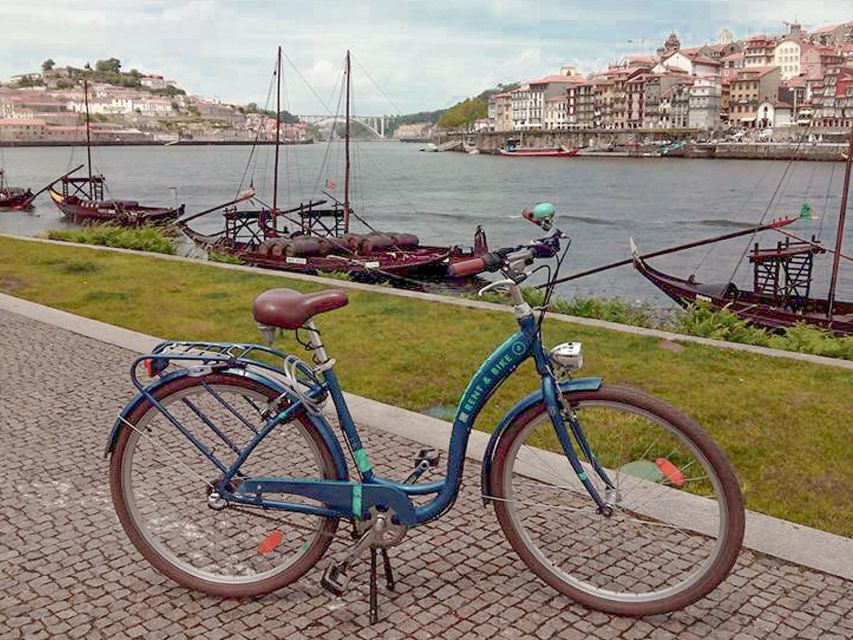 Porto: Self-Guided Bike and Boat Tour with Port Wine Tasting - Crossing Dom Luís I Bridge into Gaia