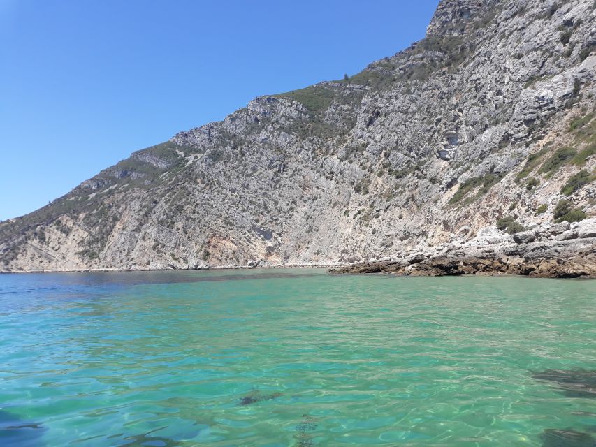 Sesimbra: Secret Bays and Beaches Boat Tour with Snorkeling - Praia da Cova: the first look at clear water